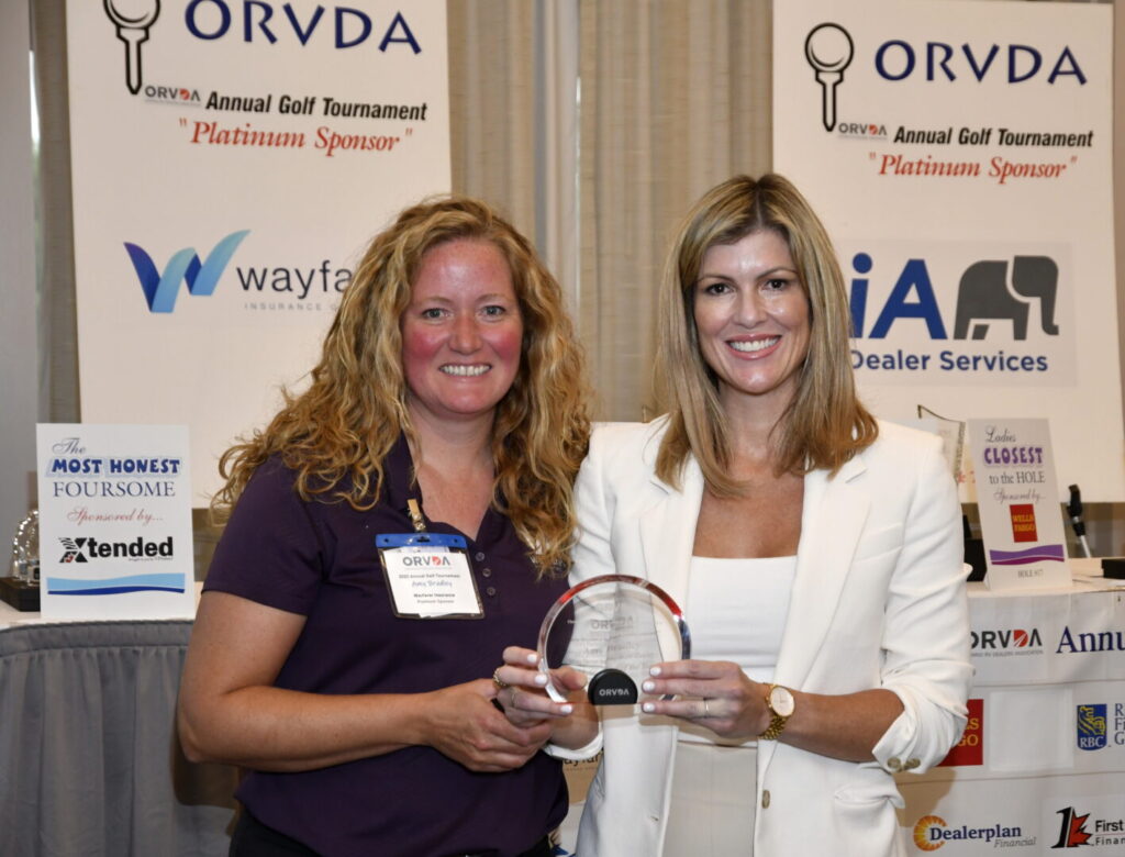 ORVDA's Natalie Conway, right, presents the Associate Member of the Year Award to Amy Bradley of Wayfarer Insurance.