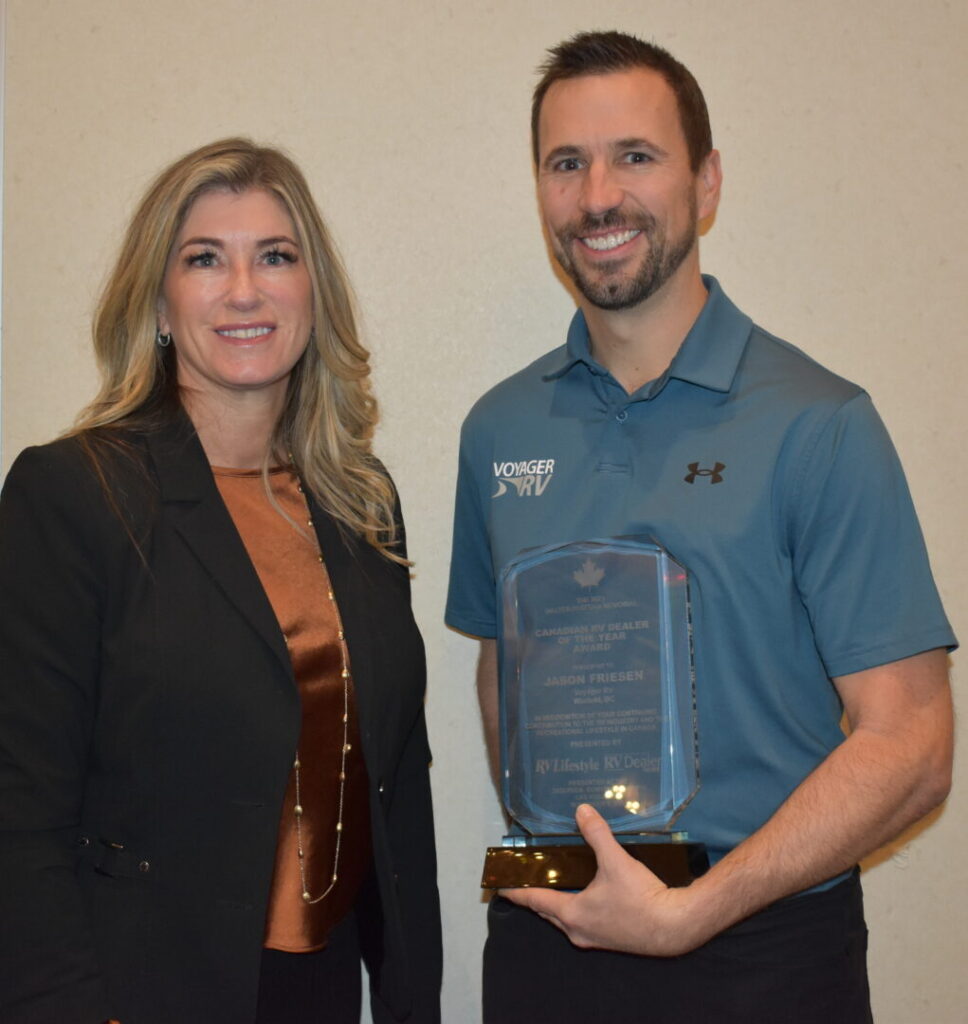 Melanie Taylor presents the 2023 Canadian RV Dealer of the Year award to Jason Friesen.