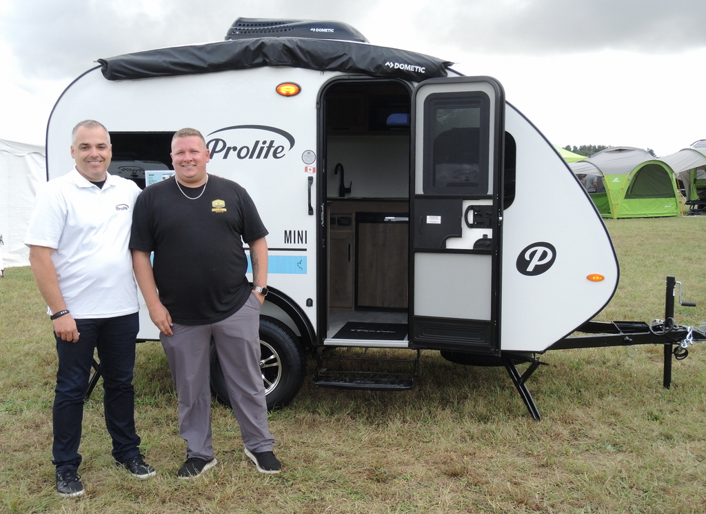 Frederic Delwiche, left, President of Roulottes Prolite, shows the 2025 models to Matt MacDonald, GM of Arrkann Trailer & RV, Carstairs Alberta.