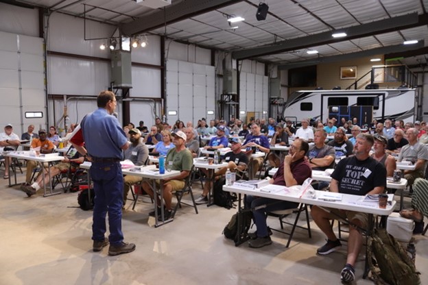 Terry Cooper speaking to a class at the Big Red Schoolhouse, home of the National RV Training Academy