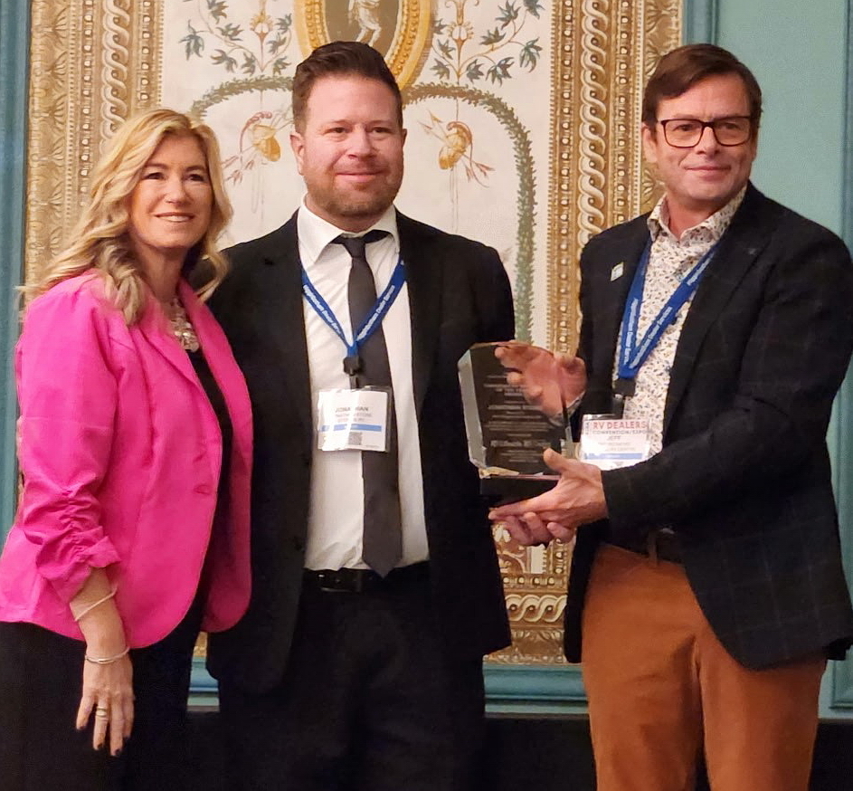 We traditionally have the previous winner present the Canadian RV Dealer of the Year Award - on Wednesday, November 12, Melanie Taylor-Wallis (left) announced the winner - Jonathan Stone, (center), and laft year's winner, Kyle Redmond, handed Jonathan his award.