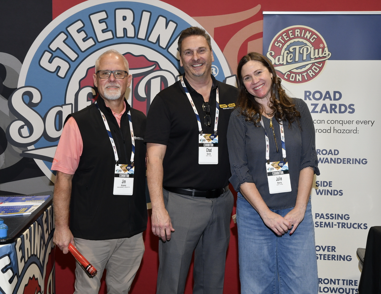 Jim Alvarez from Tom Manning and Associates, Chad Smith, and Julie Henry from Safe-T-Plus, at their booth on the NTP-Stag SeaWide Expo floor.