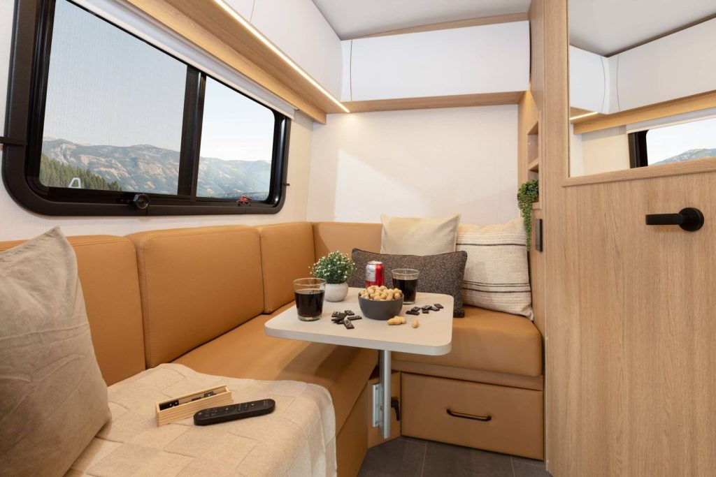 Leisure Travel Vans 2027 Wonder FX features a sectional rear sofa with wider, more comfortable seats and two large drawers underneath.
