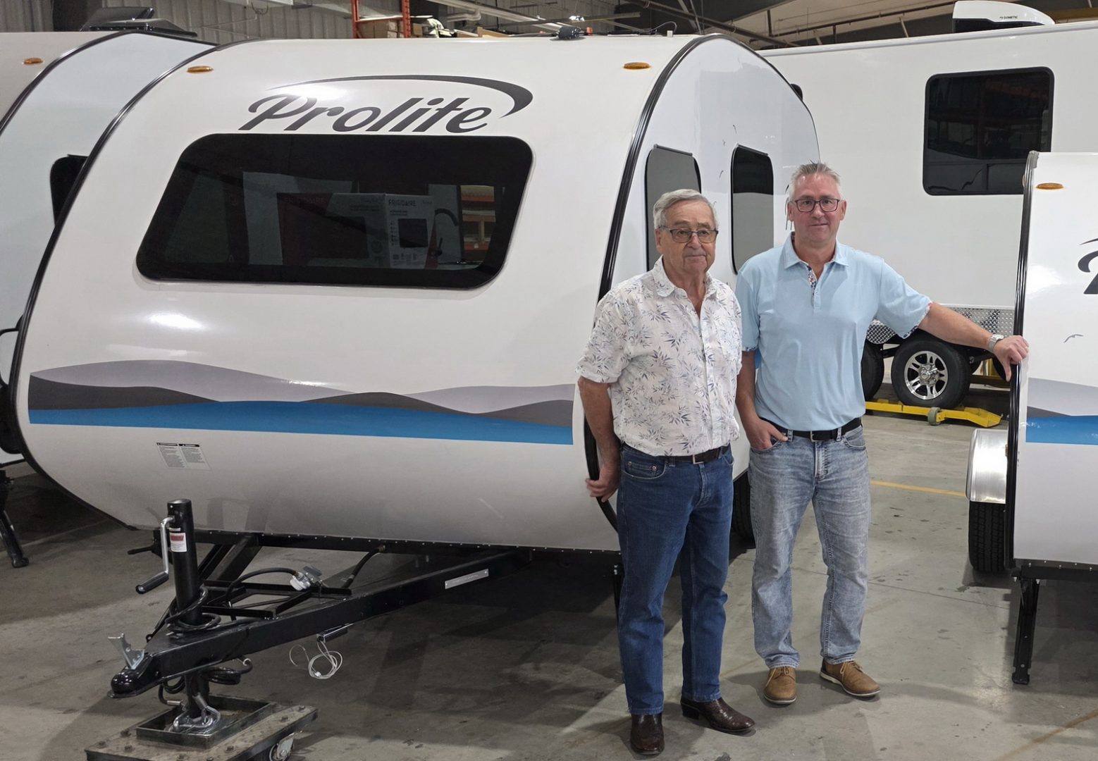 Roger Faulkner and Chris Faulkner with the 2027 Prolite travel trailer - General Coach Canada has acquired the assets of Prolite RV, and will be manufacturing the trailers in Hensall, Ontario.