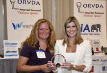 Natalie Conway, right, presents the 2023 ORVDA Associate Member of the Year to Amy Bradley.