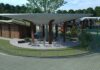 THOR EV RV Charging station concept - Amenities, including restrooms, a playground and fitness equipment, help eRV owners relax and recharge alongside their vehicles. These facilities, like the entire concept charging station, are designed to blend into their natural surroundings.