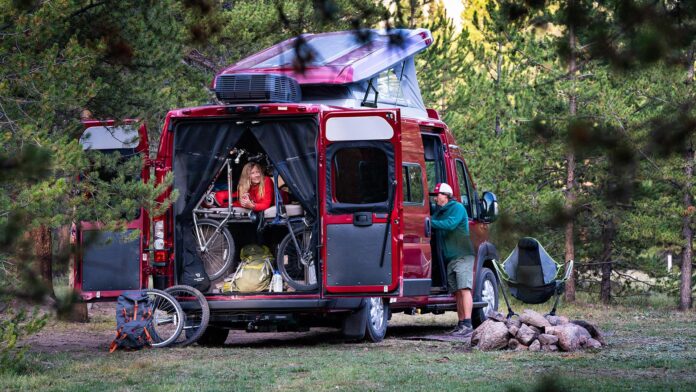 A family enjoys a camping adventure in their Winnebago class B motorhome.