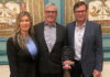 Melanie Taylor, left, Associate Publisher of RV Lifestyle Magazine and RV Dealer News, presented the 2024 Canadian RV Dealer of the Year Award to Kyle Redmond, centre, and Jeff Redmond, right, of Bucars RV, Balzac, AB.