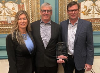 Melanie Taylor, left, Associate Publisher of RV Lifestyle Magazine and RV Dealer News, presented the 2024 Canadian RV Dealer of the Year Award to Kyle Redmond, centre, and Jeff Redmond, right, of Bucars RV, Balzac, AB.